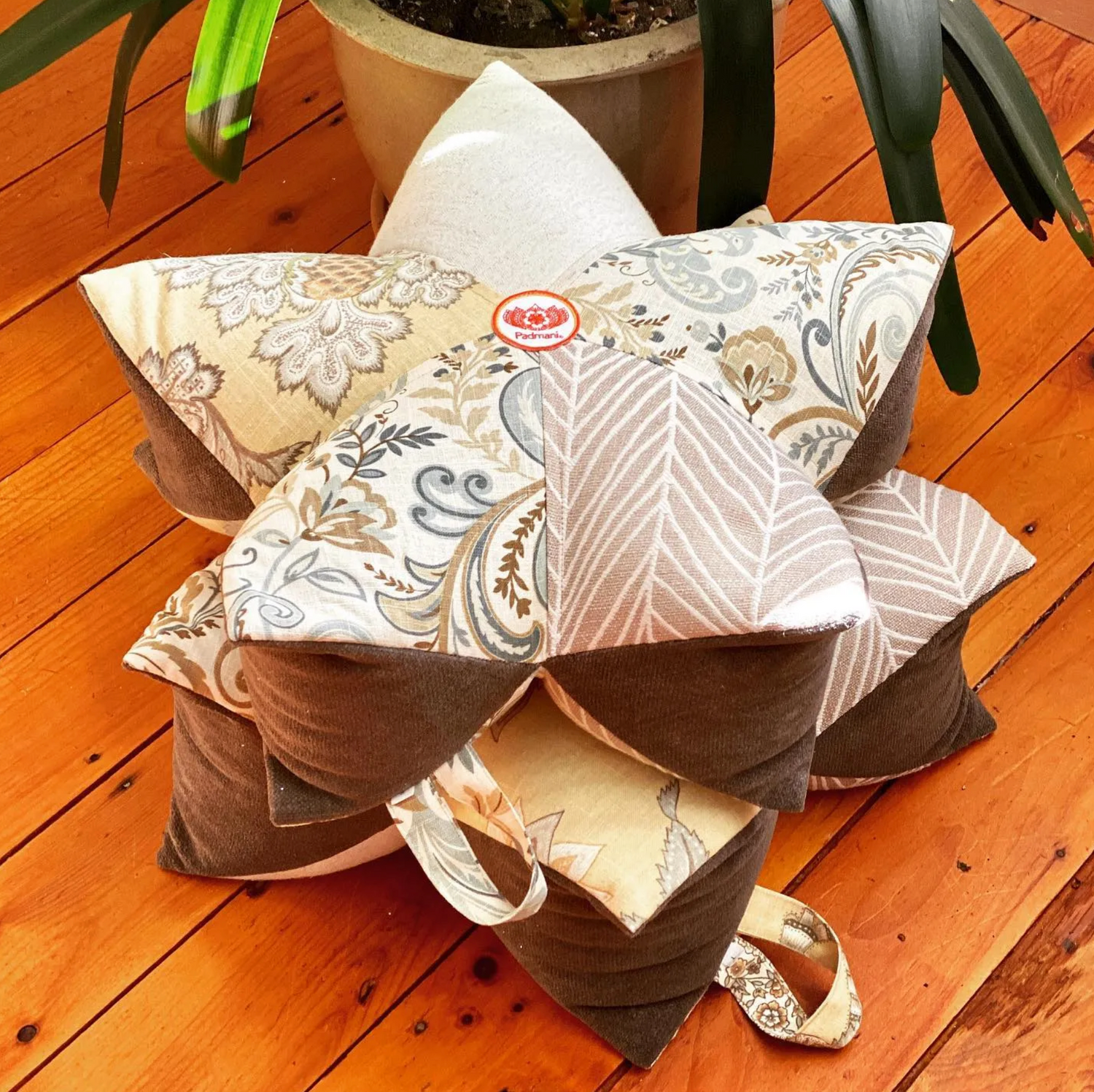 Padmani Original Lotus Pillows combine fun and function while offering superior support. Each pillow is lovingly constructed with tremendous attention to detail. The loop style handle provides portability, while our medium weight upholstery fabrics ensure